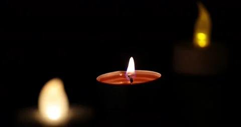 Focus change on LED light and wax candle flame light glowing jumping throbbin Stock Footage 172425406