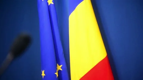 Focus changes on microphones and European Union and Romania's flags Stock-Footage 73094655
