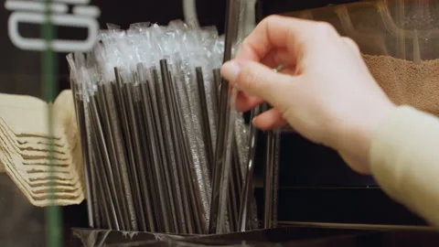 Focus on clean packaging and sanitary straw handling methods, Observation of Stock Footage 329575594