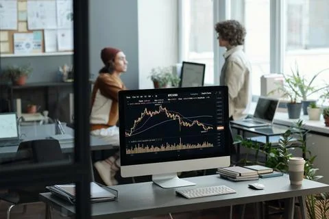 Focus on computer screen with graphic data obtained by market analyst Stock Photos
