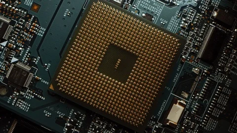 Focus on a CPU Processor Socket. Printed Circuit Board / Computer Motherboard Stock Footage 120930933