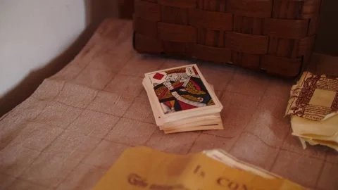 Focus to a deck of playing cards on a table Stock Footage 166661664