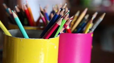 Focus defocus of several colored pencils in cans Stock Footage 55912482