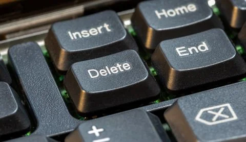 Focus on a delete key on a simple laptop computer keyboard, object macro de.. Stock Photos