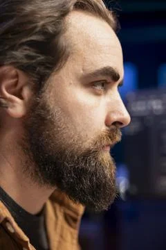 Focus on developer typing code on computer, close up shot on face Stock Photos