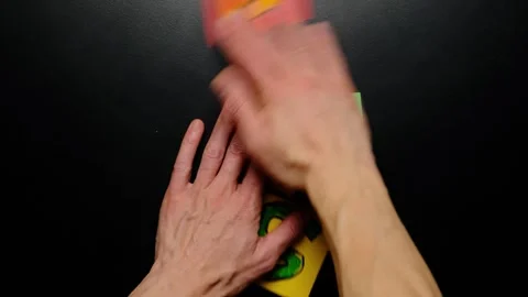 Focus dissolves into chaos as hands break the formed word focus into scattered Video stock 324812207