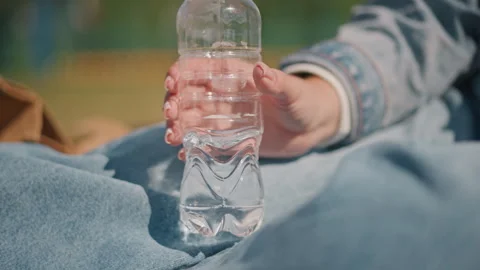 Focus on ecological details. Examining bottle texture and reflection. Intimate Stock Footage 346544922