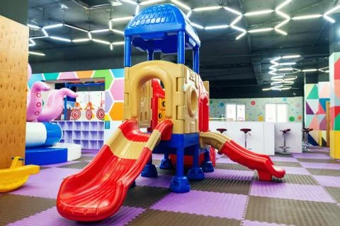 Focus on empty multicolor slides in children's entertainment centre Stock Photos