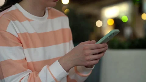 Focus on female hand using smartphone and posting social media Stock Footage 195360161