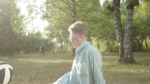 Focus on the foreground, in a good weather two best friends are sitting on the Stock Footage 174483573