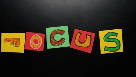 Focus forms in stop motion as chaotic sticky notes move and align into the word Stock Footage 324812132