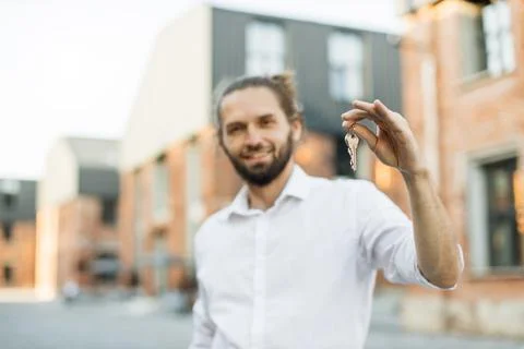 Focus on hand with keys. Stock Photos