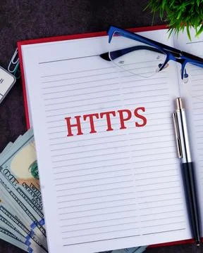Focus on HTTPS as a Cybersecurity Measure With Office Supplies, Money, and .. Stock Photos