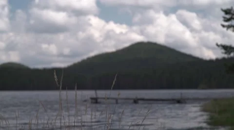 Focus on Lake Path Handheld 4K Stock Footage 63976393