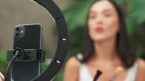 Focus light ring with phone camera live streaming two beauty blogger. Blithe Stock Footage 273965087