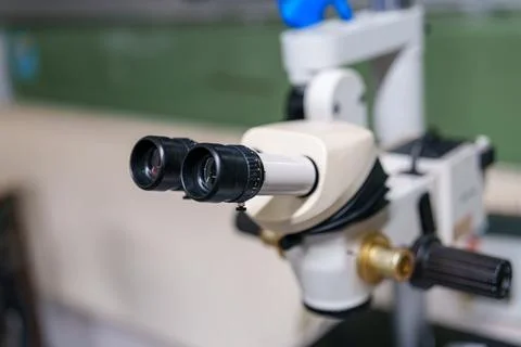 Focus on the microscope in a laboratory setting during a science class Stock Photos