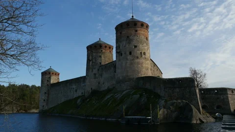 Focus moving from tree to Olavinlinna fortress, Finland Video stock 120065657