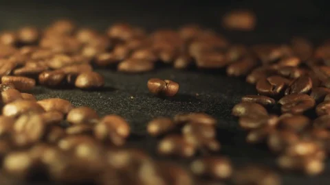Focus on one coffee bean on the background of many coffee beans Stock Footage 102421002