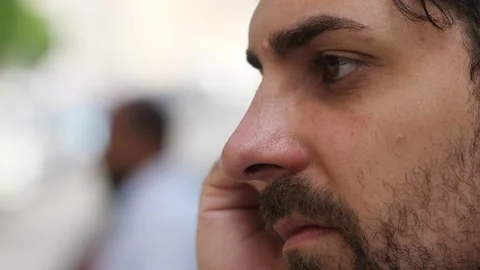 Focus on a pensive young man's face absorbed in his thoughts Stock Footage 220495242
