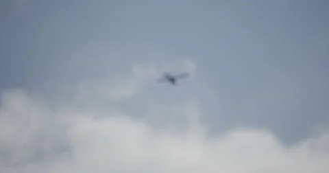 Focus In Plane Flies Overhead Towing Advertisement 스톡 동영상 56190268