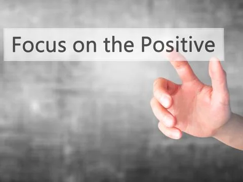 Focus on the Positive - Hand pressing a button on blurred background concept  Stock Photos