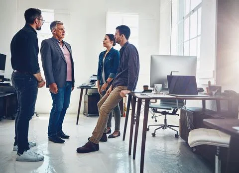 Focus on problems rather than solutions. a group of designers having a Stock Photos