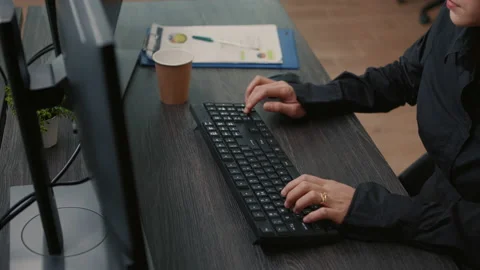 Focus on programer hands typing code on keyboard while looking at computer Stock Footage 168232585