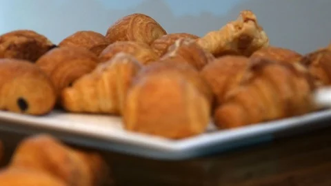 Focus pull across a plate of croissants Stock Footage 126715926