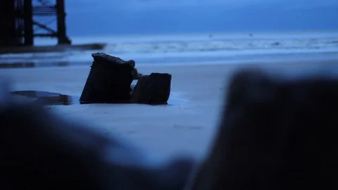 Focus Pull of Beautiful Calm Dusk Ocean Waves Through Distressed Wood Silhouette Vídeo Stock 94477472