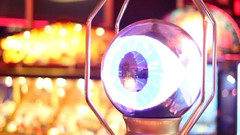 Focus Pull Between Machines with Neon Lighting in Seaside Amusement Arcade Vídeo Stock 94474830