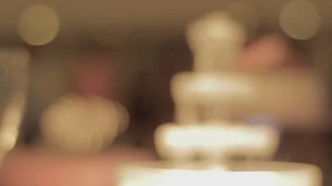 Focus pull from blurred wedding reception scene to close up on crystal Stock Footage 108644111
