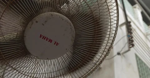 Focus Pull of a Building Through a Fan in Motion in Souk Mutrah (4K) Stock Footage 45871944