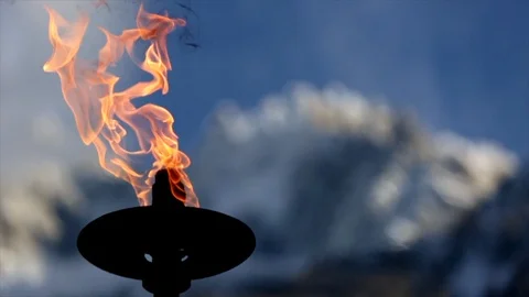 Focus pull from burning fire to Mountain Stock Footage 108637647