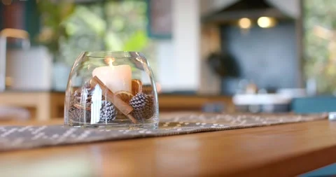Focus pull causing camera shifting from glass jar candle to blurred kitchen, Stock Footage 335130740