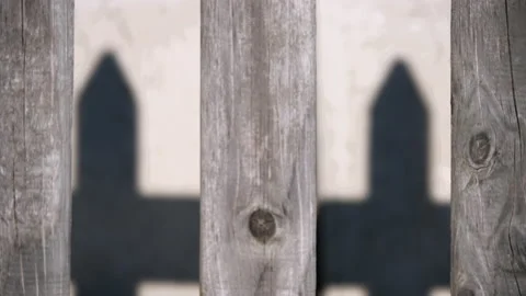 Focus pull from fence to its shadow Stock Footage 170091897