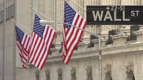 Focus pull on flags hanging in Wall Street, New York Stock Footage 44117536