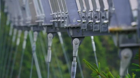 Focus pull to high-tensile steel cable structure on Sky Bridge walkway Stock Footage 299830372