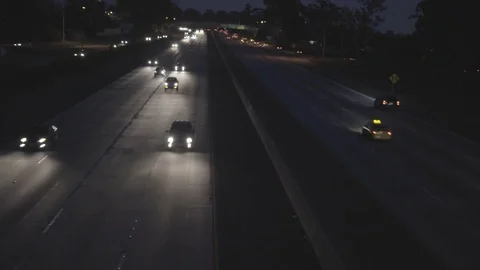 Focus Pull Highway Traffic at Night Stock Footage 73874462