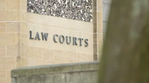 Focus pull onto Law Courts exterior sign on a courthouse building. Stock Footage