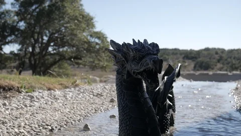 Focus Pull of Loch Ness Monster Sea Dragon Statue in Water Stock Footage 122230553