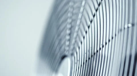 Focus pull of modern metallic office fan ventilator against white background Stock Footage 65380390