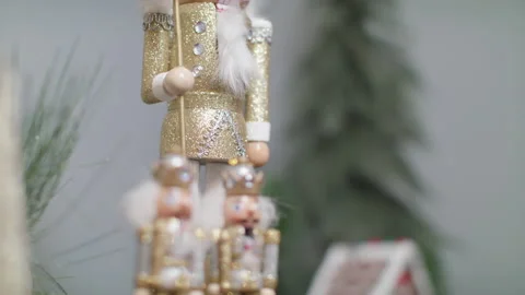 Focus pull from a nutcracker to a gorgeous decorated christmas tree for Stock Footage 138607639