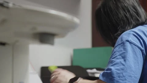 Focus Pull from Office Copier Printer to Busy Healthcare Administrator at Desk Видео 338423481