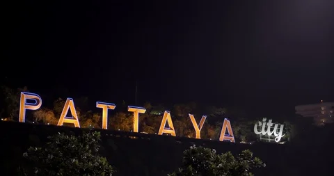 Focus pull shot of Pattaya city light sign board landmark Stock Footage 107696956