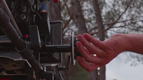 Focus Puller Turning Follow Focus Wheel to Adjust Lens Focus on Professiona.. Stock Footage 345530909