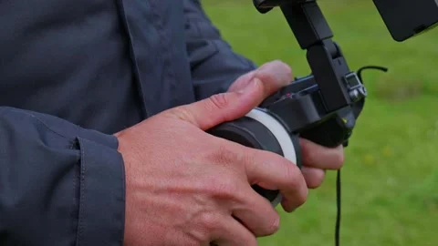 Focus Puller Using Wireless Remote Focus Controller on Professional Film Set Stock Footage 333538510