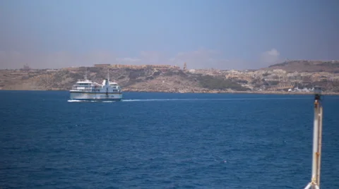 Focus pulling of ferry leaving Malta, from boat Stock Footage 65311998