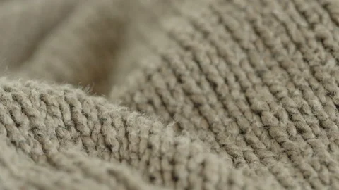 Focus pulling on knitted cardigan surface 4K video Stock Footage 189961984