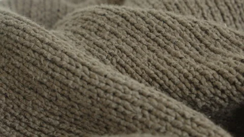 Focus pulling over knitted jumper surface 4K video Stock Footage 188777964