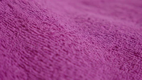 Focus pulling over pink towel 4K video Stock Footage 214099987